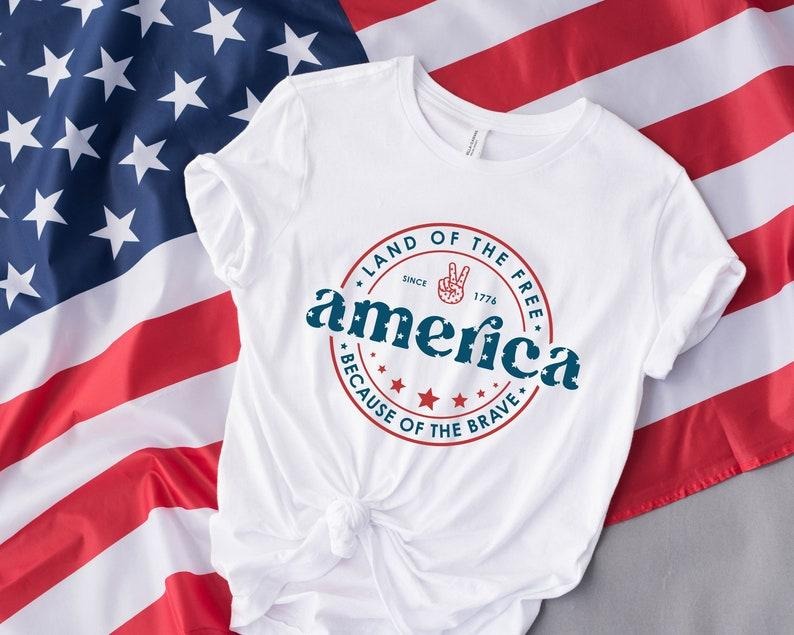 America 4th July Land Free Because Brave Patriotic - Adult & Kids T-Shirts, Sweatshirts & Hoodies apparel design preview 1