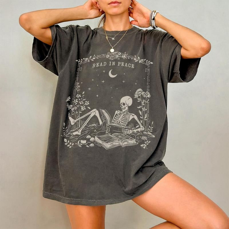 Read Peace Comfort Colors Bookish Halloween Skeleton - Adult & Kids T-Shirts, Sweatshirts & Hoodies apparel design preview 1