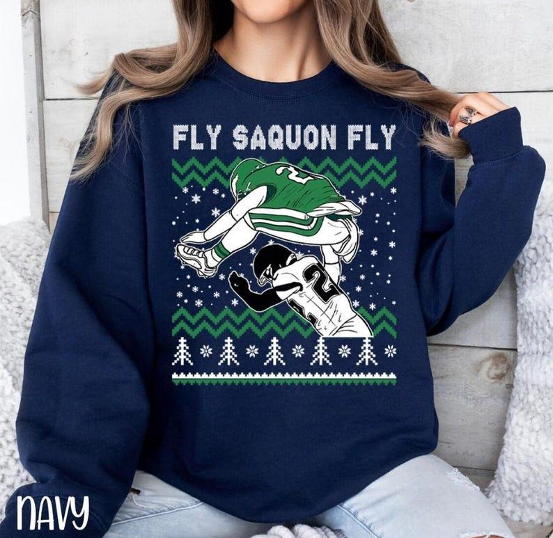 Saquon Barkley Jump Ugly Merry Football - Adult & Kids T-Shirts, Sweatshirts & Hoodies apparel design preview 1