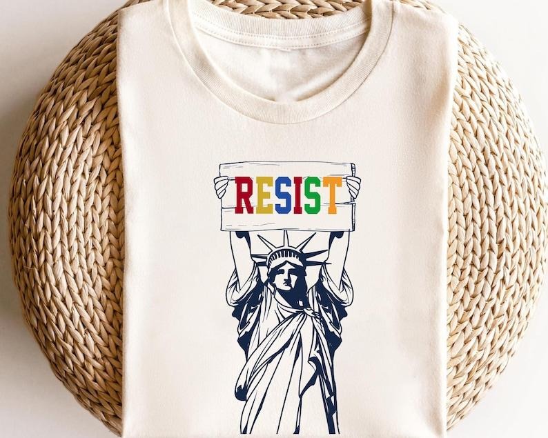 Statue Liberty Resist Feminist - Adult & Kids T-Shirts, Sweatshirts & Hoodies apparel design preview 1
